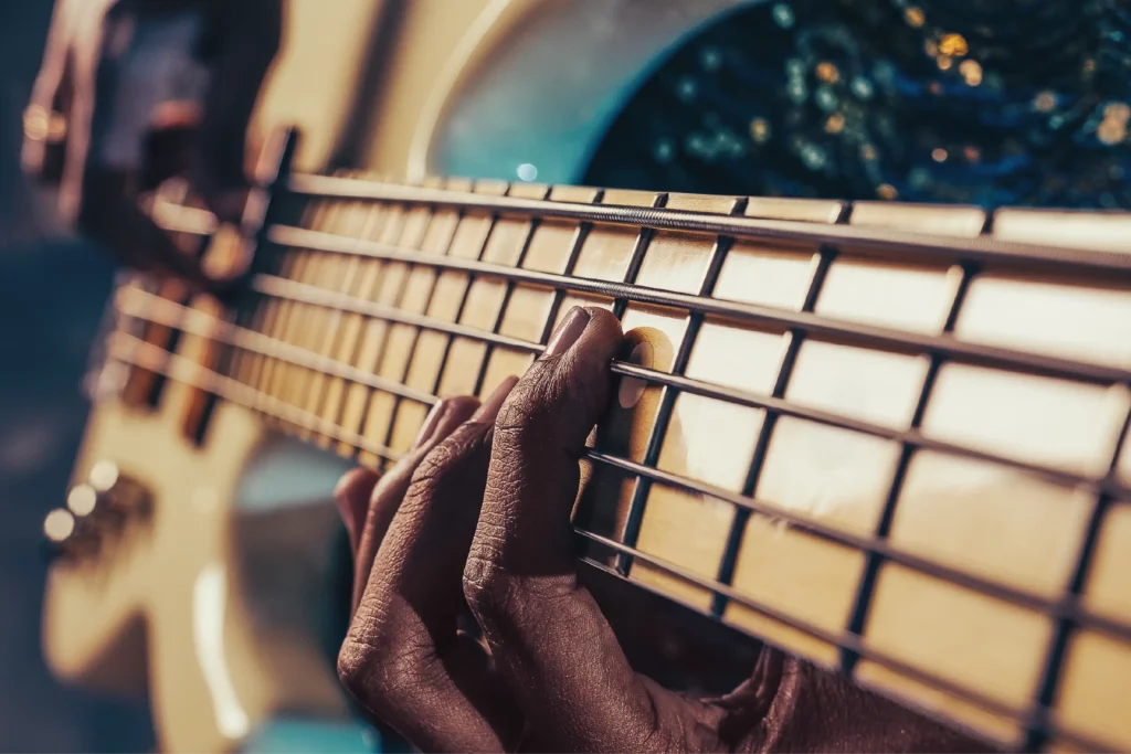 Man playing blues music on bass guitar in memphis tennessee.