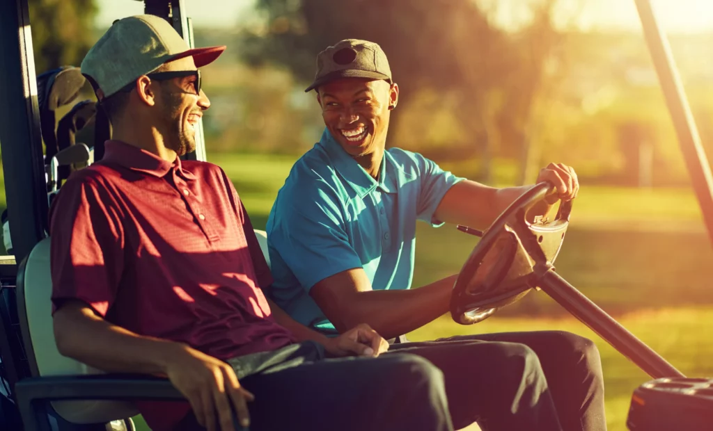 Laughing friends on golf trip in south carolina booked with acx travel.
