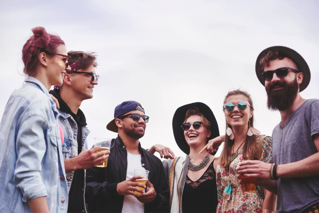 Group of friends exploring local beer brewers on craft beer tour booked with acx travel.
