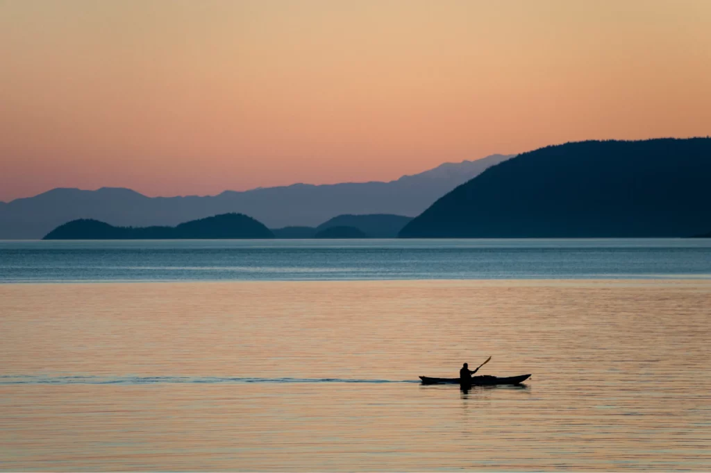 Kayaking the san jaun islands on excursion booked with acx travel.