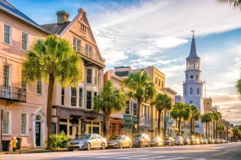 Street in charleston south carolina at sunset on trip booked with acx travel.